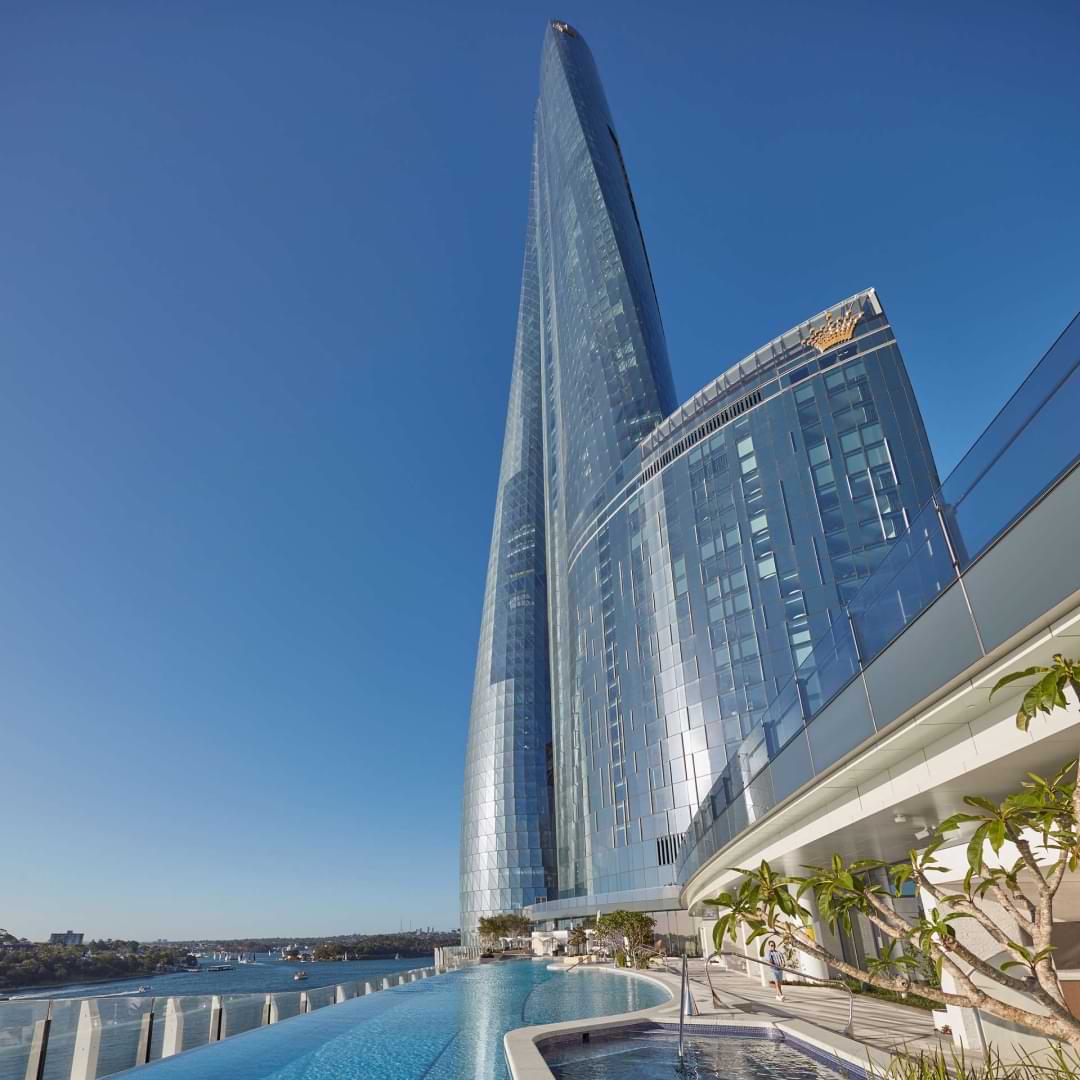 Lexus Encore partner, Crown Hotel Sydney photographed on a sunny day, with the pool and Crown tower glistening. 