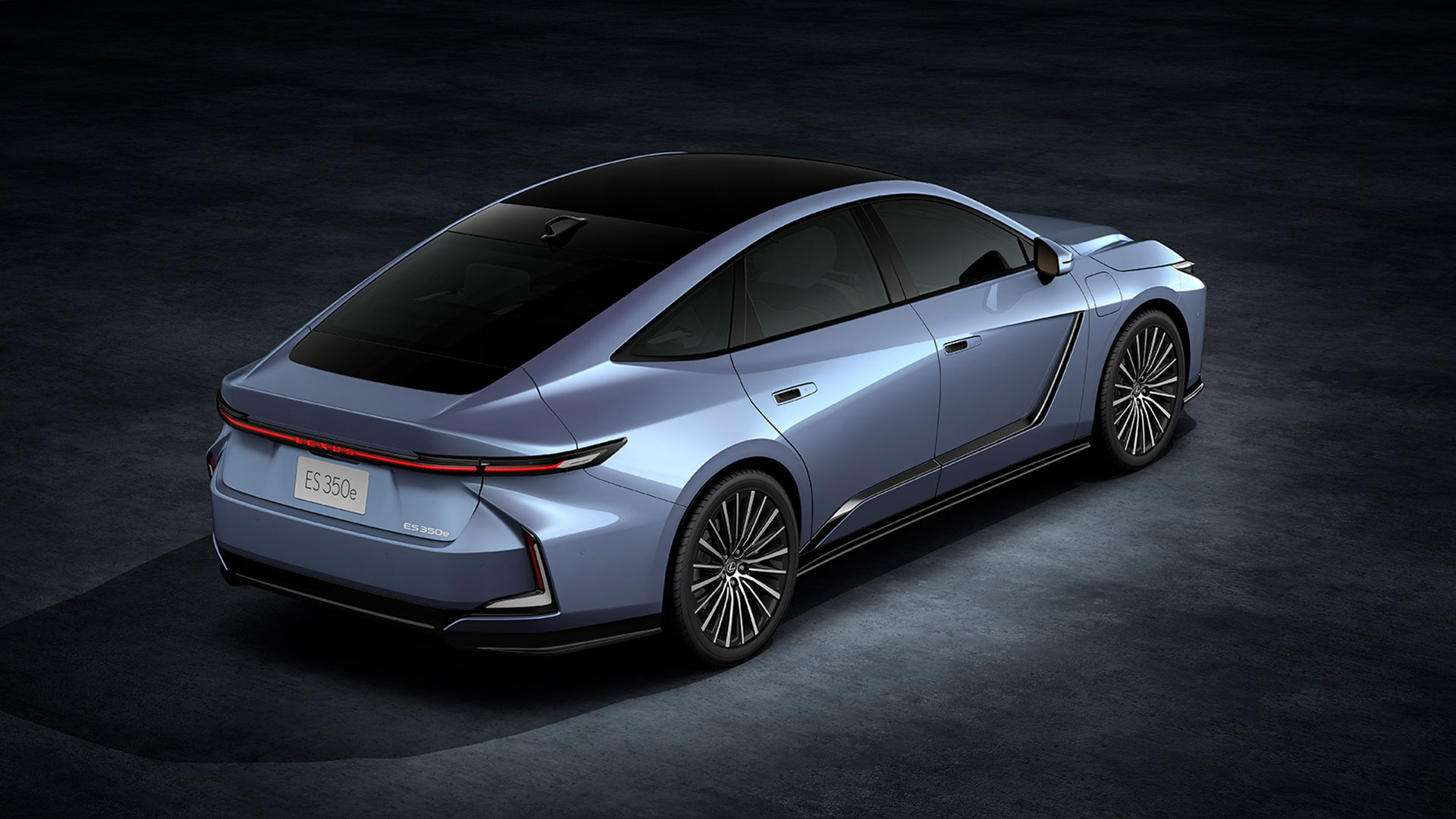 Light blue 2026 Lexus ES 350e all-electric sedan, rear view  in studio setting.